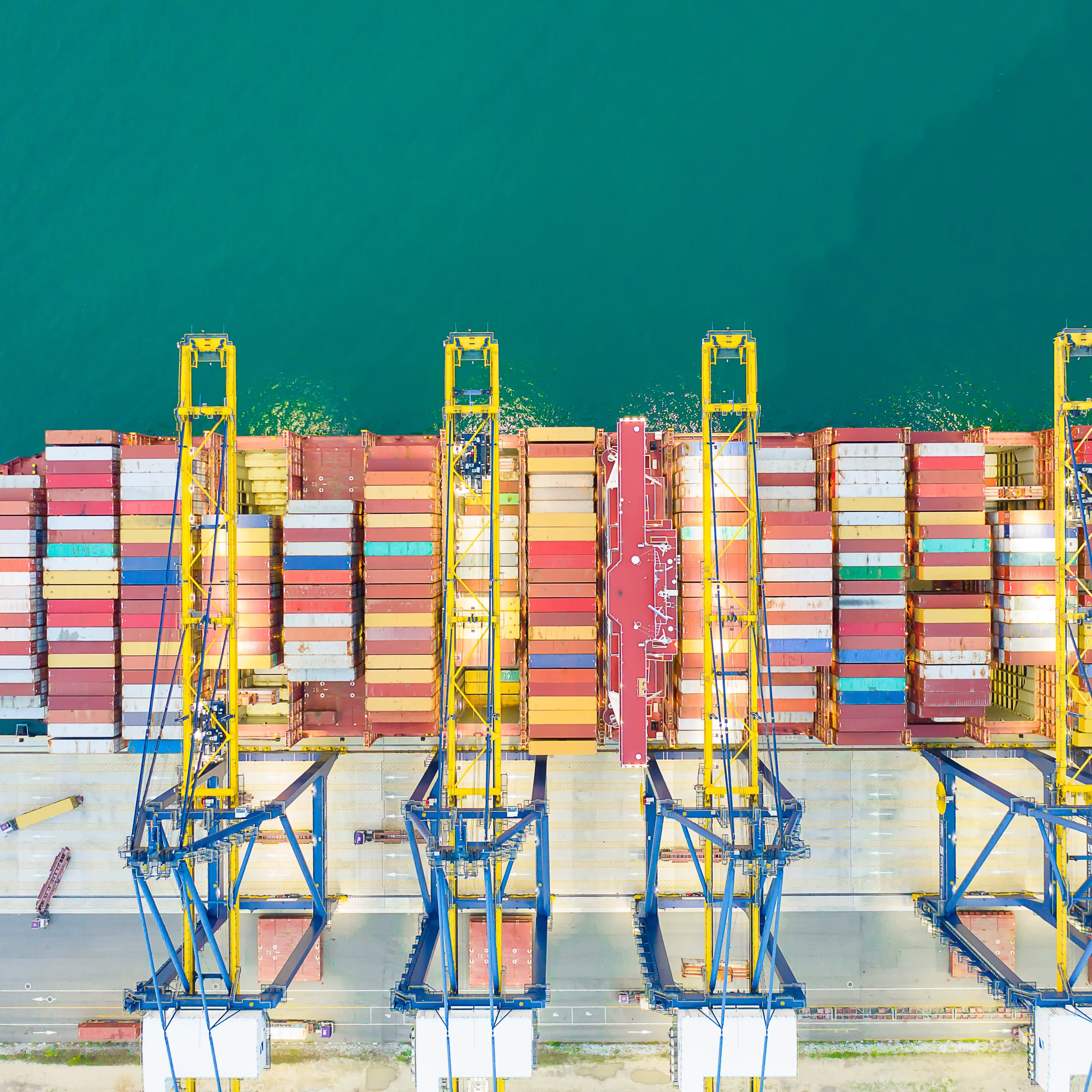Container ships, cranes, and logistics fuel the import-export business, connecting global trade and maritime transport.